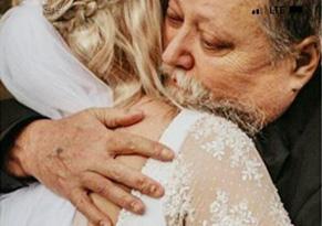 Hug between bride and father
