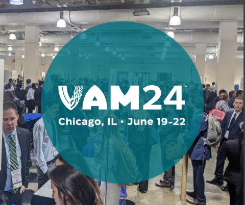 VAM24 logo over a photo of a VAM exhibit hall