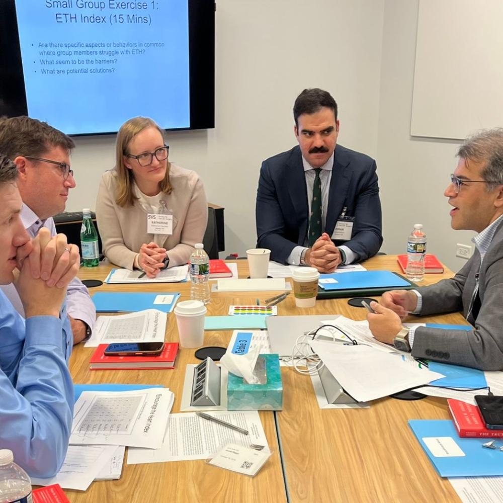 People discussing issues at a table