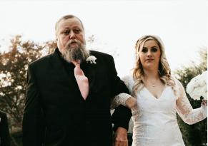 Dad with daughter at wedding.